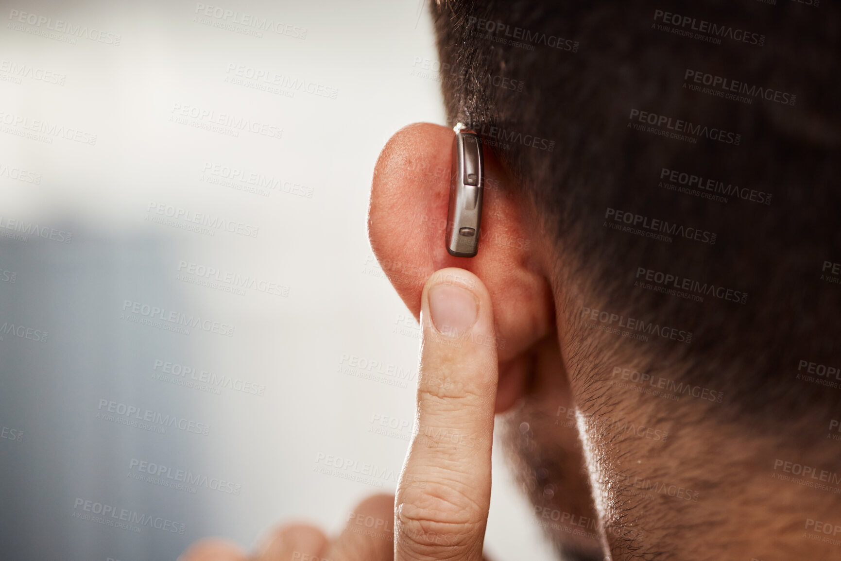 Buy stock photo Closeup of ear, hearing aid and man with disability from the back for support, improve listening or amplifier with mockup space. Deaf patient, face and audiology implant to help volume of sound waves