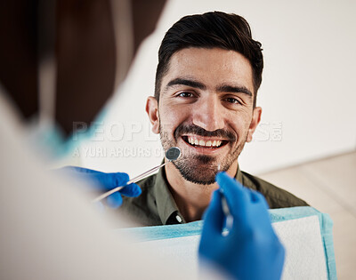 Buy stock photo Portrait, man and hands of dentist with tools for dental, healthcare or check in clinic. Face smile, orthodontics and patient with doctor, mirror and excavator for teeth cleaning and medical hygiene