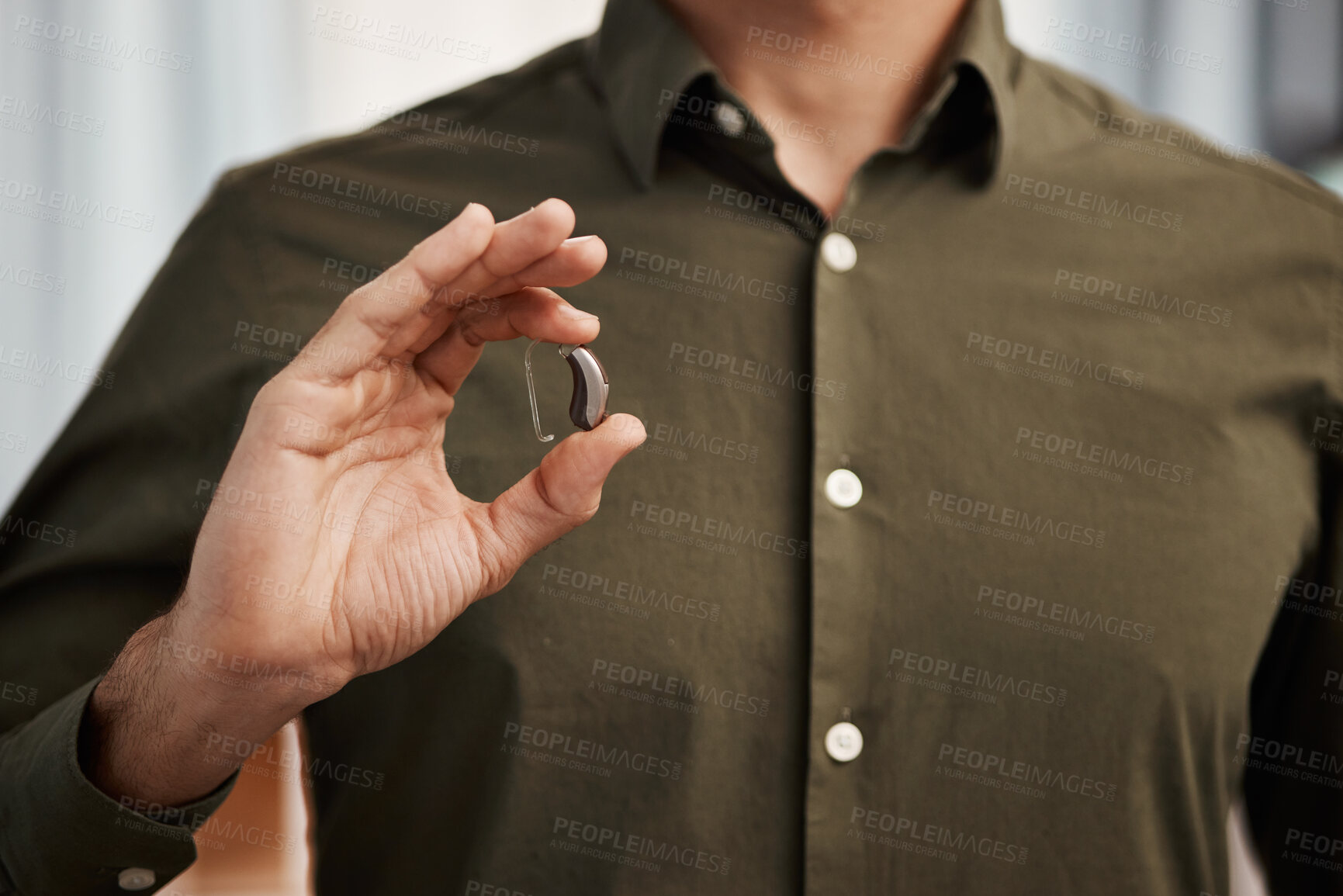 Buy stock photo Hearing aid, business man with disability and hands show communication implant for support, listening and medical innovation. Closeup of deaf person with audiology tech to help volume of sound waves