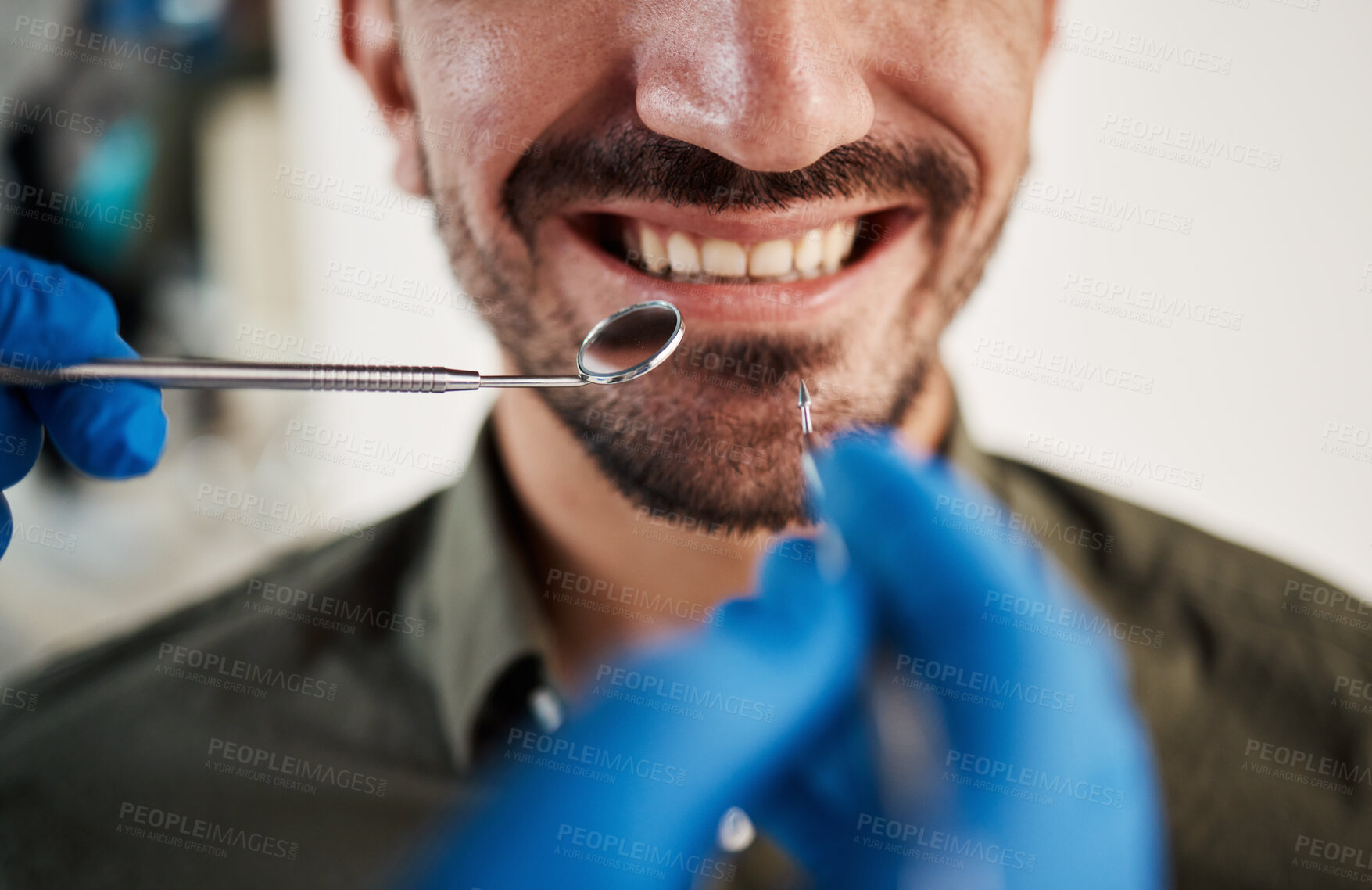 Buy stock photo Smile, man and hands of dentist with tools for dental, healthcare or check in clinic. Tooth wellness, orthodontics and patient with doctor, mirror and excavator for teeth cleaning and medical hygiene