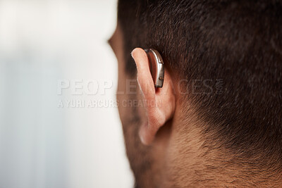 Buy stock photo Closeup of hearing aid, ear and man with disability from the back for medical support, listening or healthcare at mockup space. Deaf patient, face and audiology implant to help volume of sound waves