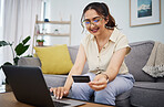 Woman, credit card and ecommerce on laptop in home for digital payment, fintech password and online shopping. Happy female customer, computer and banking code for financial bills, budget and account