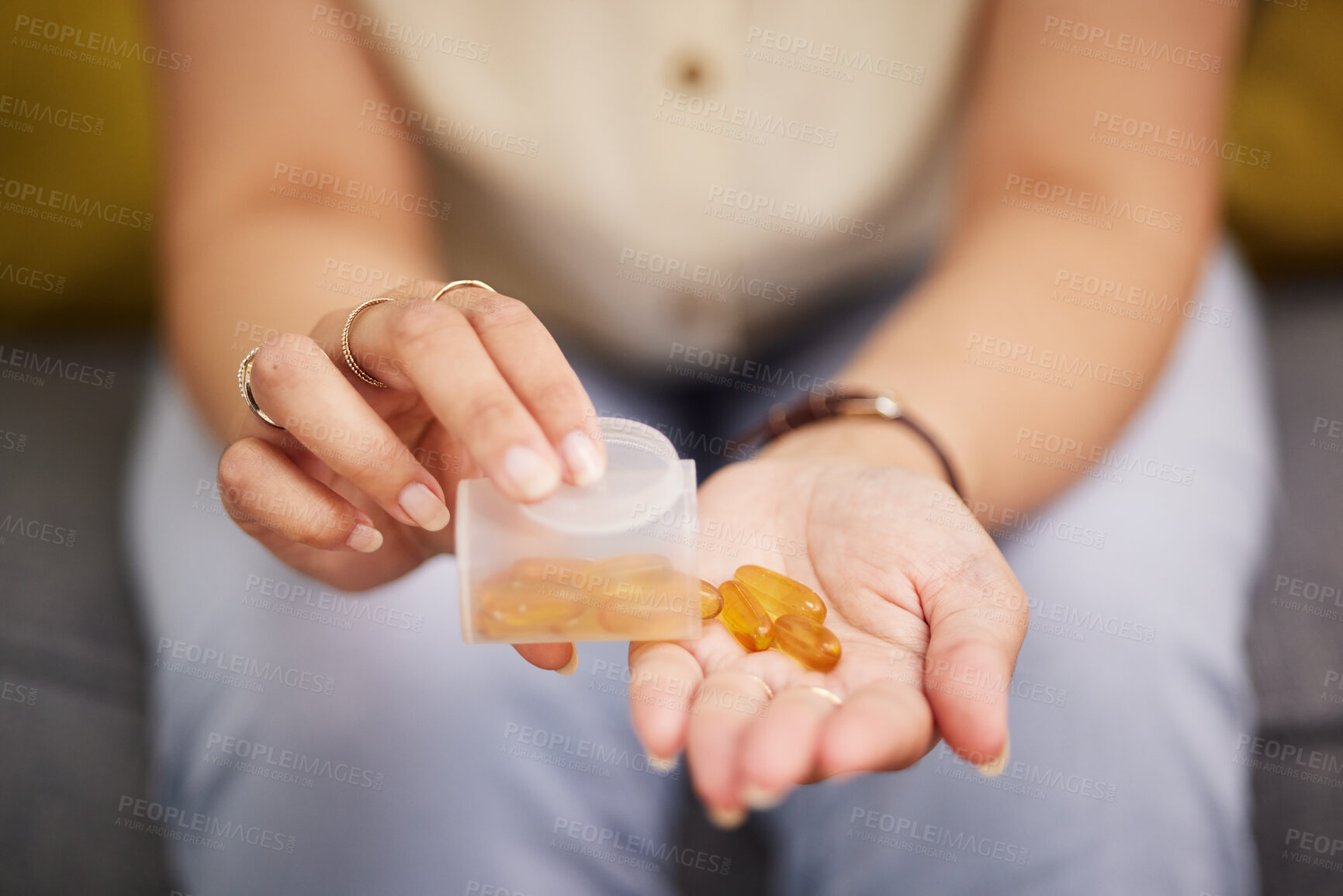 Buy stock photo Hands, pills and a person with fish oil for health, wellness and medicine for diet. Closeup, bottle and a woman with medication or a healthcare supplement in the morning for medical goals or support