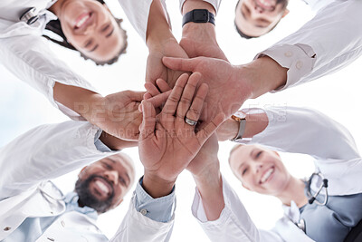 Buy stock photo Hospital doctors, happy people and circle hands together for healthcare teamwork, medical team building and clinic celebration. Solidarity, below view and group surgeon for collaboration success