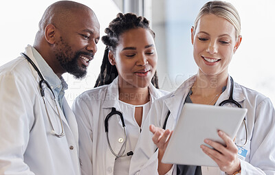 Buy stock photo Smile, healthcare and doctors reading on a tablet for results, medical advice or planning. Happy, typing and a surgeon with African employees and technology for help, collaboration or cardiology