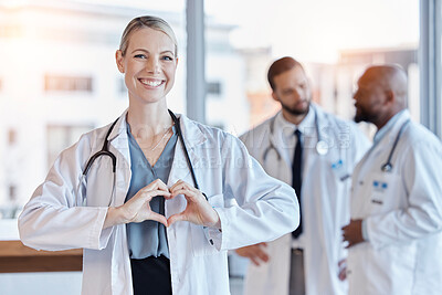 Buy stock photo Healthcare, heart and hands with portrait of doctor in hospital for medical, support and kindness. Motivation, wellness and medicine with woman and gesture in clinic for cardiology, care and emoji