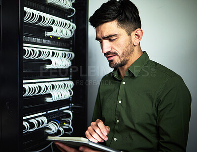 Buy stock photo Engineer man, cable and tablet in server room for programming, maintenance and software upgrade. Serious technician person with technology in data center for wire, hardware and internet connection