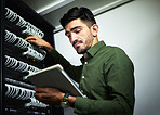 Server room, cable and engineer man with a tablet for programming, maintenance and software upgrade. Young technician person with technology in data center for problem solving and internet connection