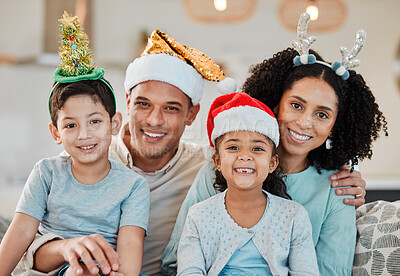 Buy stock photo Family home, parents and kids in Christmas portrait, hat or smile on sofa for celebration in living room. Mother, father and happy young children for xmas party, event or holiday for culture on couch