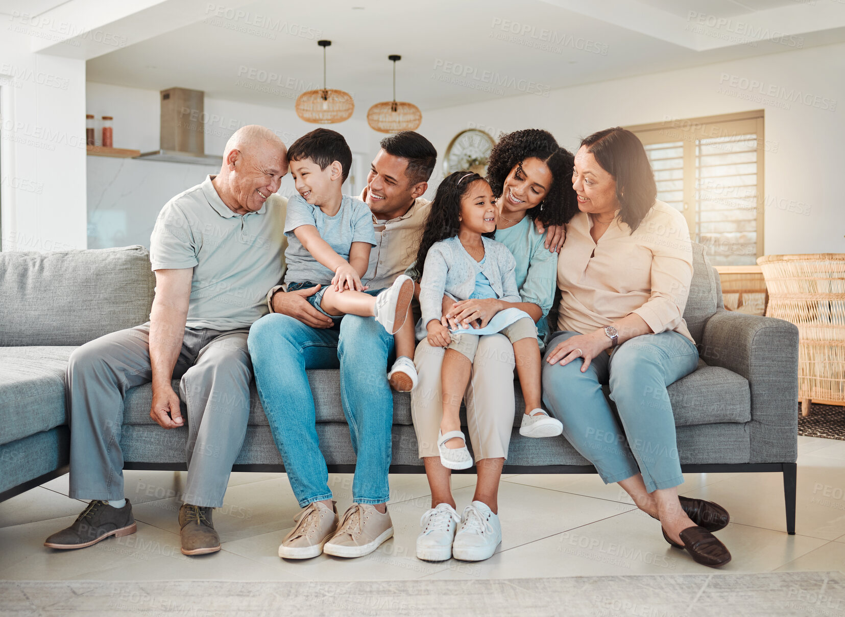 Buy stock photo Happiness of grandparents, parents and kids on sofa together, support and love in home or apartment. Men, women and children on couch, smile to relax and generations of happy family in living room.