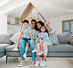 Family, children and portrait for home insurance, investment on financial safety on sofa with mother and father. Parents, kids and interracial people with cardboard roof for house cover and security