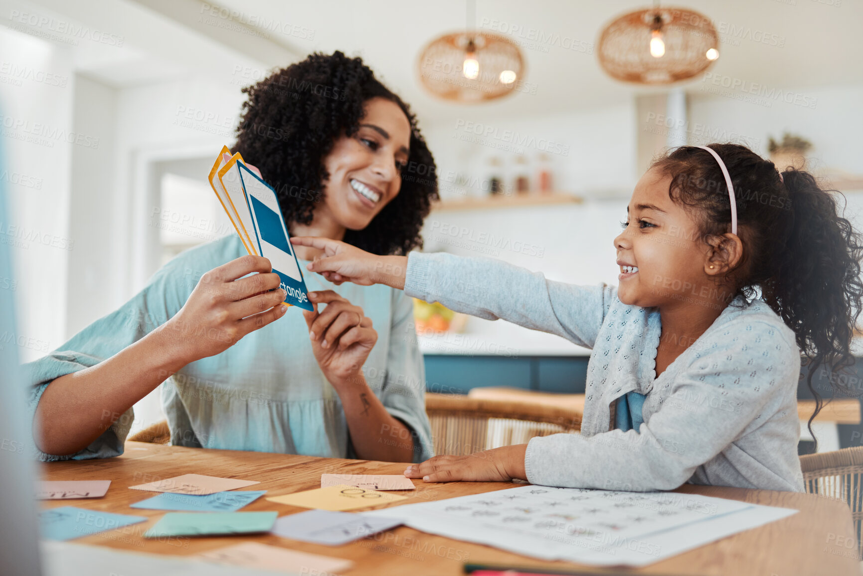 Buy stock photo Homework, education and mother with girl with cards for learning, child development and studying. Family, school and happy mom with kid at table with paper for creative lesson, growth and knowledge