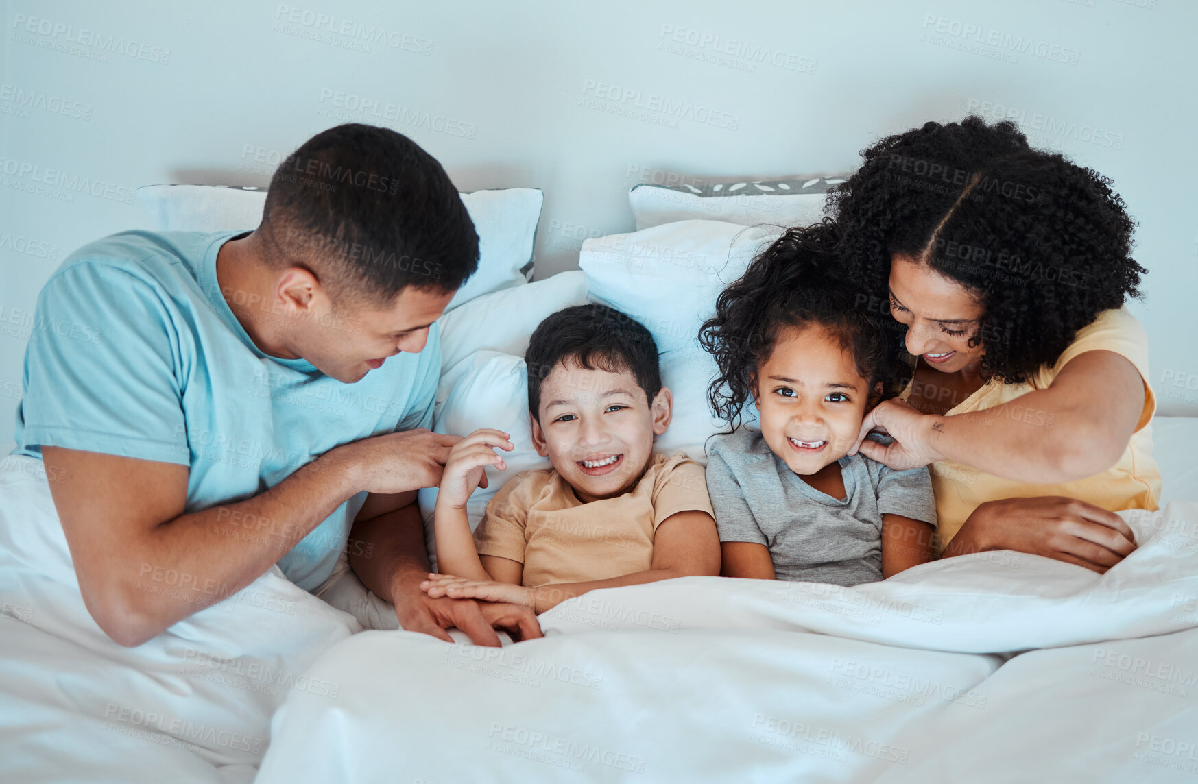 Buy stock photo Top view, family and parents with children in bed for bonding, quality time and affection in morning. Happy, love and portrait of mother, father and kids in bedroom for fun, sleeping and relaxing