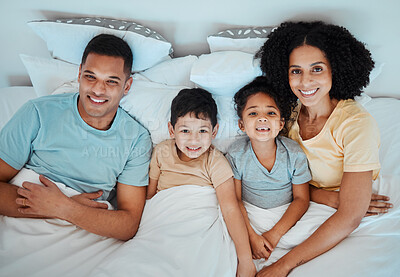 Buy stock photo Top view, bed and portrait of parents with children for bonding, quality time and affection in morning. Happy, family and above of mother, father and kids in bedroom for fun, sleeping and relaxing