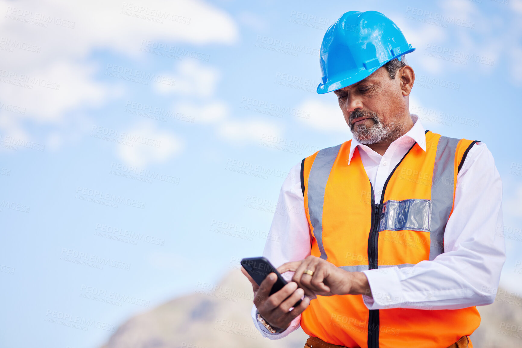 Buy stock photo Phone, construction worker and typing communication in the city for planning, building and project management with engineer. Cellphone, online conversation and senior man with internet connection