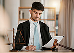 Attorney man, scales and hammer with writing, documents and notes for reading, thinking and crime analysis. Advocate, lawyer or judge with legal research, paperwork and analytics for court evidence