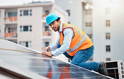 Buy stock photo Technician man, tape and solar panel on roof with thinking, sustainable vision and construction in city. Engineer, tools and photovoltaic system with building, measuring and renewable energy in cbd