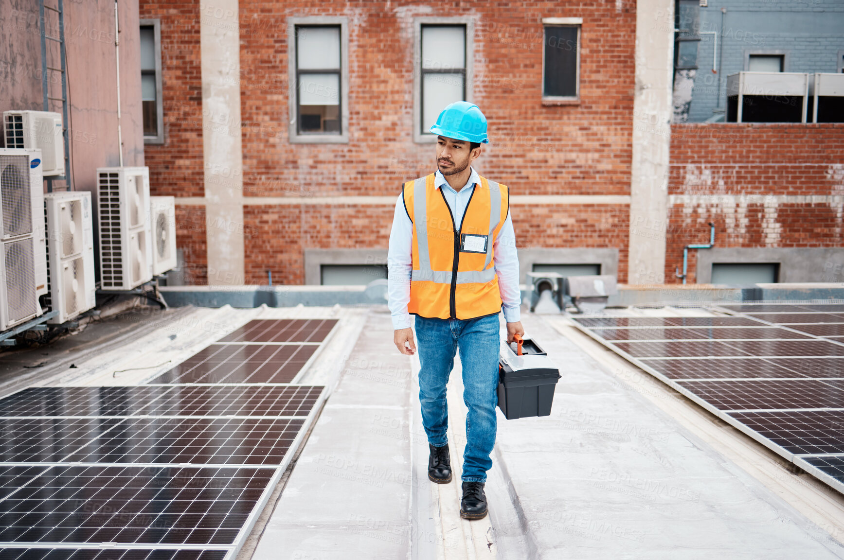 Buy stock photo Solar panel, tool box and inspection with man on roof top for renewable energy, project or power. Construction, electricity or technician with contractor in city for engineering and photovoltaic grid