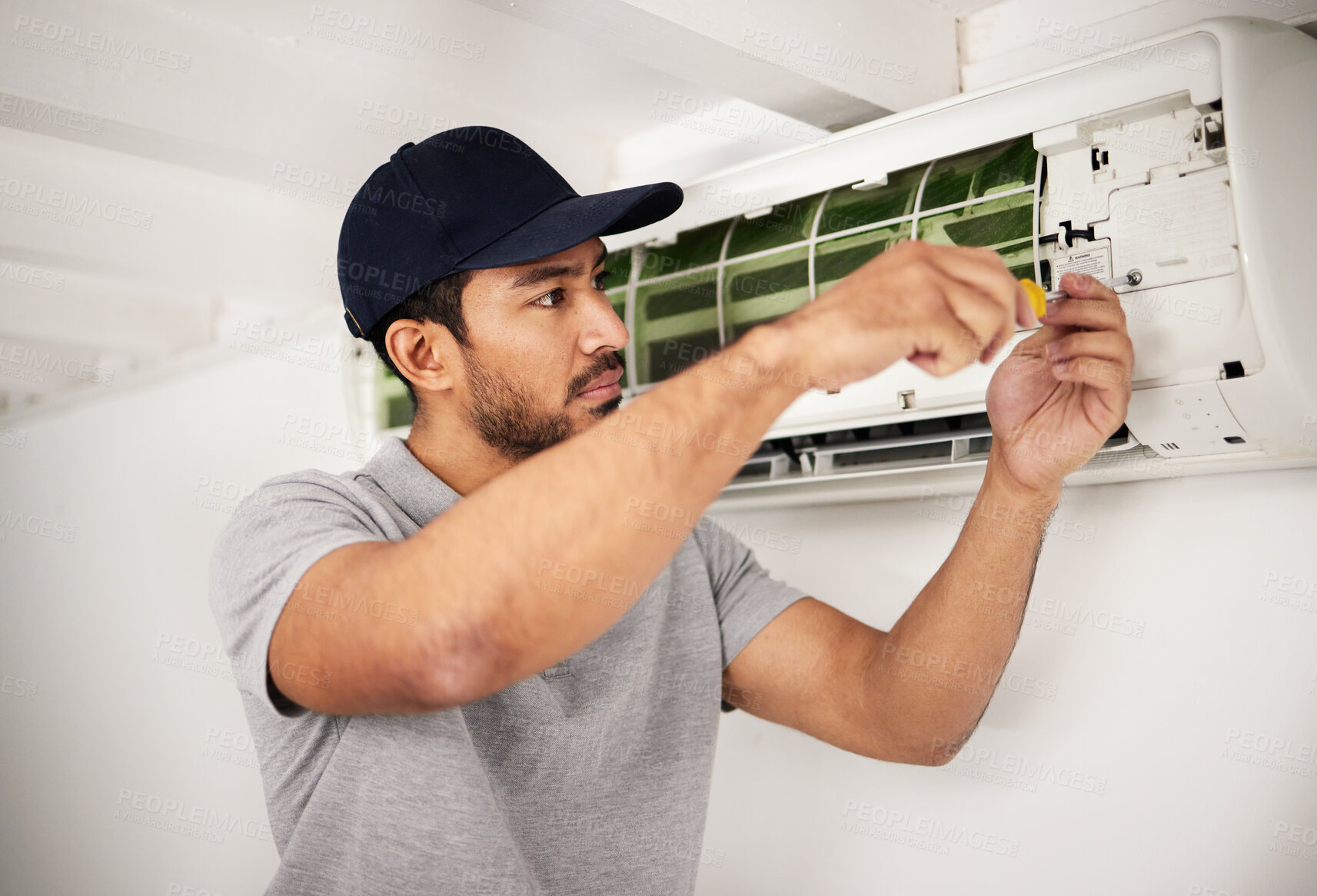 Buy stock photo Maintenance, air conditioner technician and man with screwdriver working on ventilation for ac repair. Contractor, handyman or electric aircon machine expert problem solving, electrician with tools.