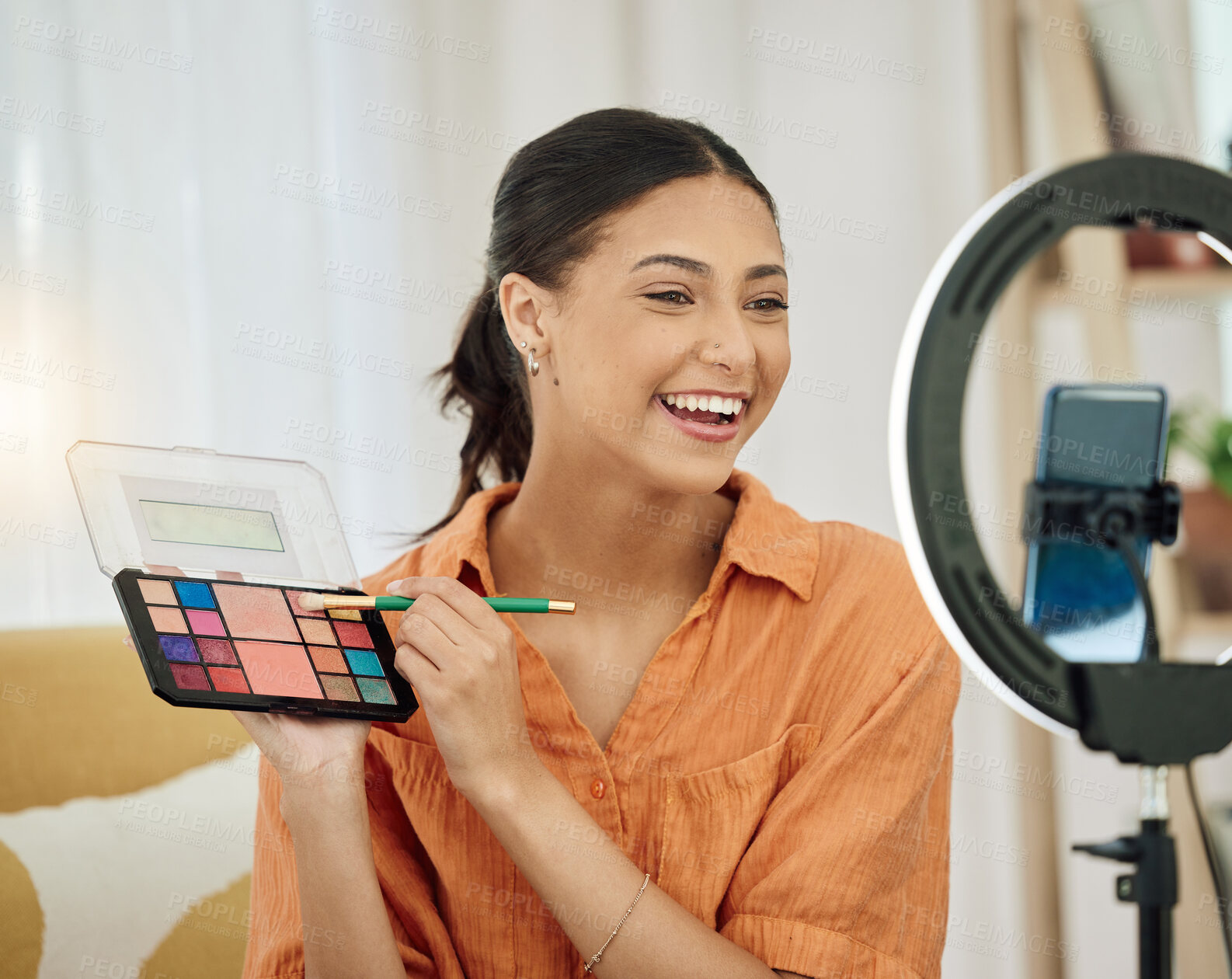 Buy stock photo Woman, makeup influencer and live streaming on social media for beauty vlog with lighting. Female gen z content creator with cosmetics palette for online broadcast, mobile podcast and digital review