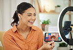 Happy woman, makeup influencer and live streaming with phone, social media and beauty vlog at home. Gen z content creator with cosmetics palette for online broadcast, mobile podcast or digital review