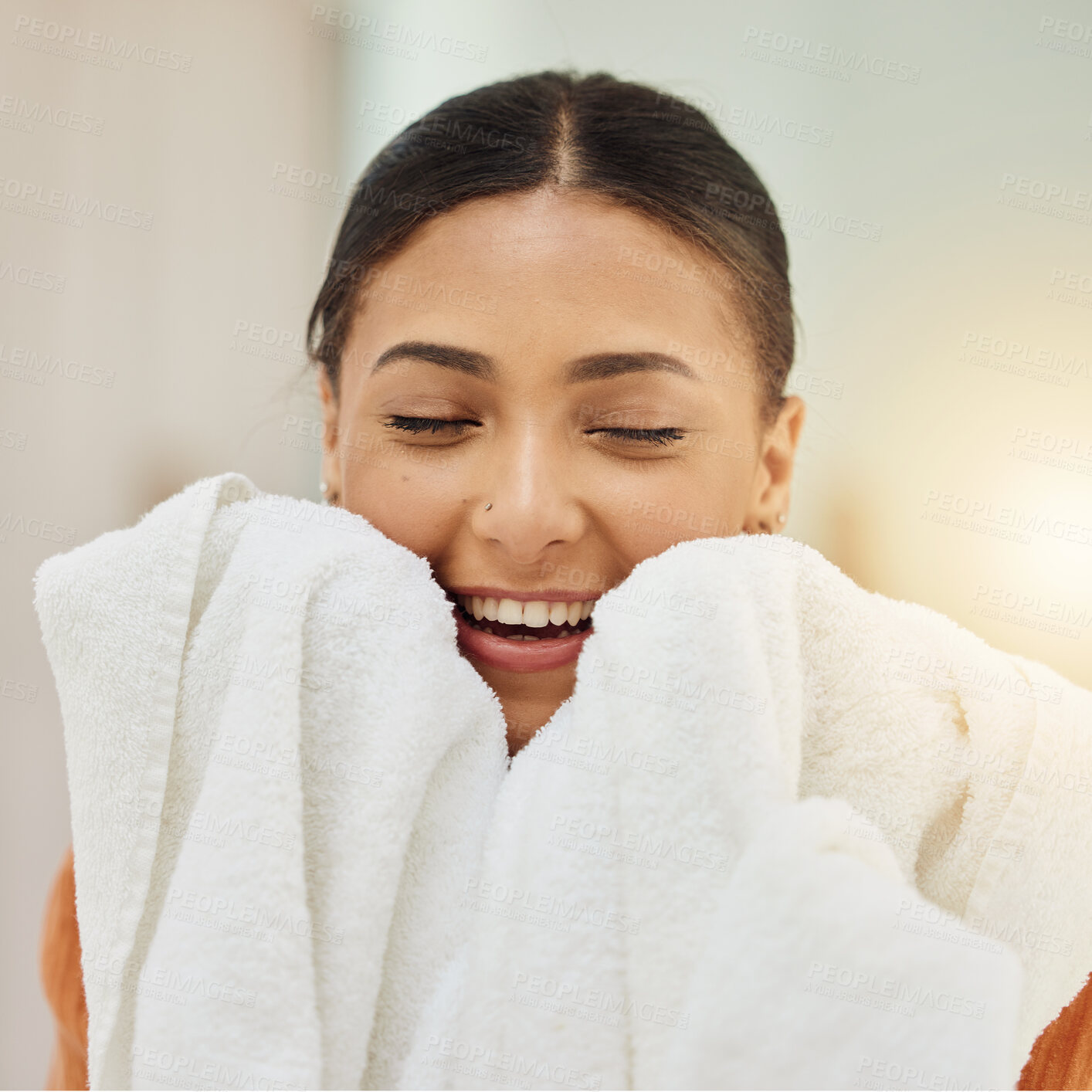 Buy stock photo Smile, woman and smell clean towel, fresh scent and fabric after washing cotton or textile for housekeeping in home. Laundry, aroma and happy person with cloth after cleaning for hygiene and wellness