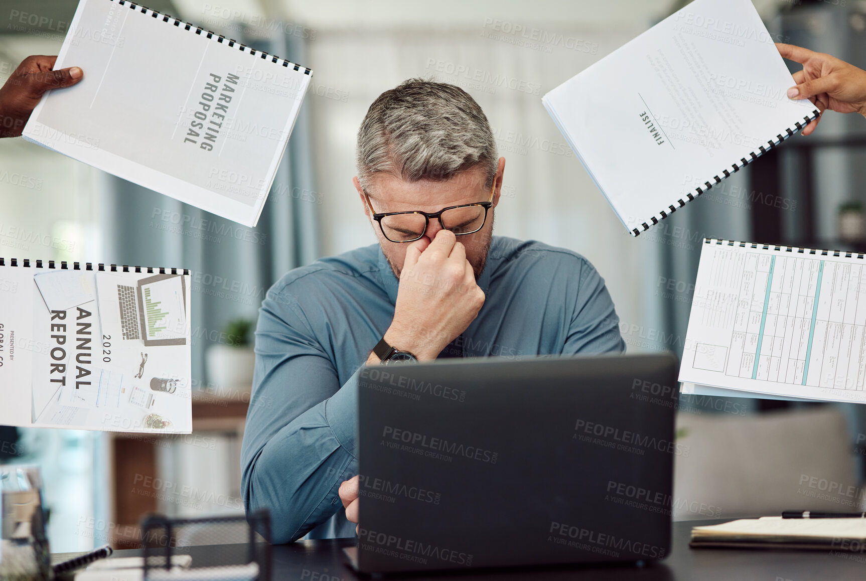 Buy stock photo Business man, stress and overwhelmed with headache, documents and staff hands in busy office. CEO, manager or tired boss with laptop, paperwork and burnout with employee group at marketing agency