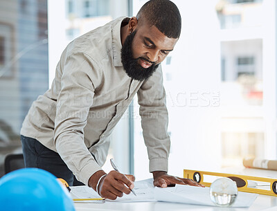 Buy stock photo Architect, blueprint and black man writing in office on paper, construction and project planning. Engineer, architecture and male manager with plan for property and renovation strategy with focus