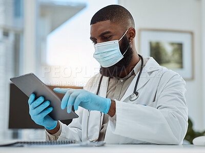 Buy stock photo Doctor, black man and tablet in office for medical review, data research or healthcare app. Hospital physician with face mask planning on digital technology for telehealth, consulting and information