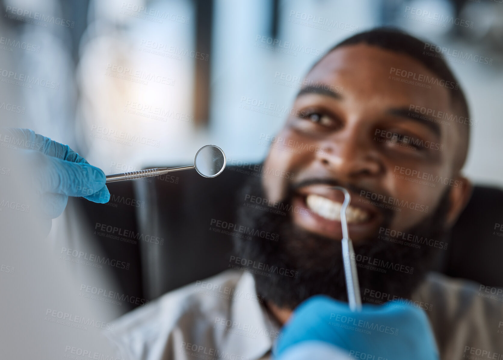 Buy stock photo Man, hands and dentist tools for cleaning in clinic for medical treatment, teeth whitening or veneer hygiene. Smile, mirror and dental excavator for African patient in mouth health checkup or consult