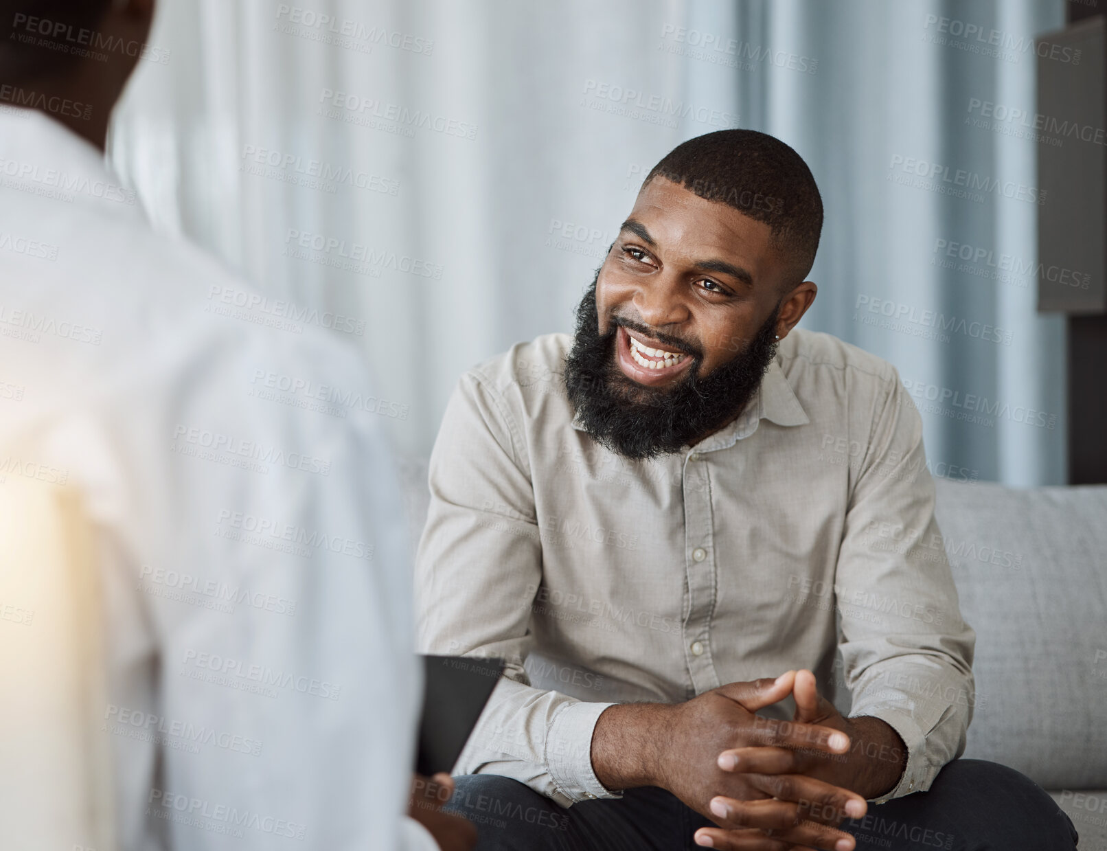 Buy stock photo Happy black man, therapist and consultation in meeting for healthcare, mental health or therapy at the hospital. African male person talking to consultant in physiology, counseling or medical help