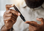 Person, hands and test blood sugar for diabetes, health analysis or medical glucometer results. Closeup of patient poke finger with needle to check insulin, measure glucose risk and diabetic medicine