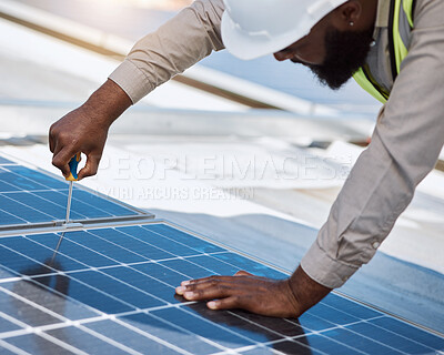 Buy stock photo Black man, engineer and repair for solar panel, roof or maintenance for industry, thinking and building. Technician, screwdriver or tools for photovoltaic tech, helmet or sustainable renewable energy