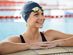 Happy, woman in water and swimming pool for competition, training or professional sports or exercise in gym or club. Swimmer, smile or happiness for winning, achievement or wellness in cardio workout