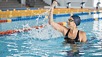 Swimming, success or happy winner in celebration for achievement in race or pool competition. Fitness, wellness or excited woman swimmer winning sports game with victory or championship performance