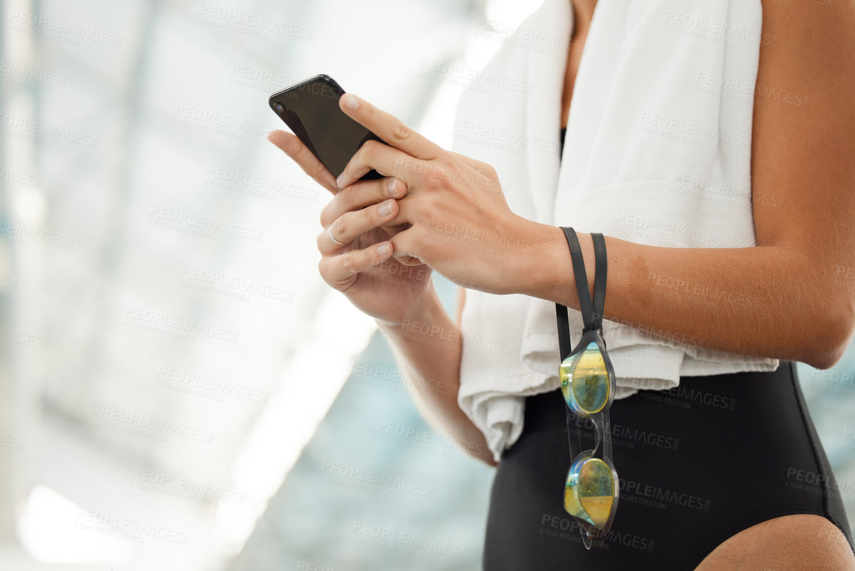 Buy stock photo Phone, hands and athlete typing at swimming pool for social media, networking and internet app. Technology, swim and woman with smartphone for website, online sport or training, workout and exercise