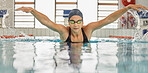 Swimming, training and a woman in a pool for cardio, fitness or exercise for health. Professional swimmer, stroke and an athlete or girl in the water for a competition, workout or indoor sports