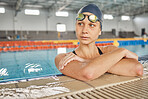 Sports, thinking or woman in swimming pool training for competition, wellness or fitness workout. Healthy, face or tired female athlete swimmer in the water for exercise or resting on break to relax