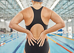 Hands, injury and back pain at swimming pool with woman during training, exercise or accident. Sport, swim and athlete with spine problem, arthritis or fibromyalgia, osteoporosis or medical emergency