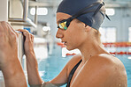 Start, sports or woman in swimming pool training for competition, wellness or fitness workout. Healthy girl, race or female athlete swimmer ready for water exercise, cardio activity or practice 