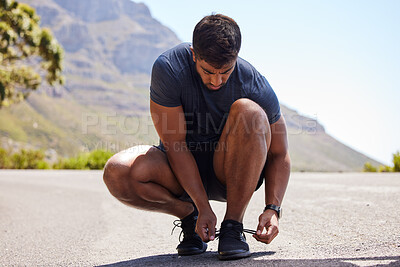 Buy stock photo Running, tie or man on road with shoes for fitness exercise, workout and marathon training outdoors. Street, lace or athlete runner ready to run, walk or jog with sneakers, trainers or footwear  