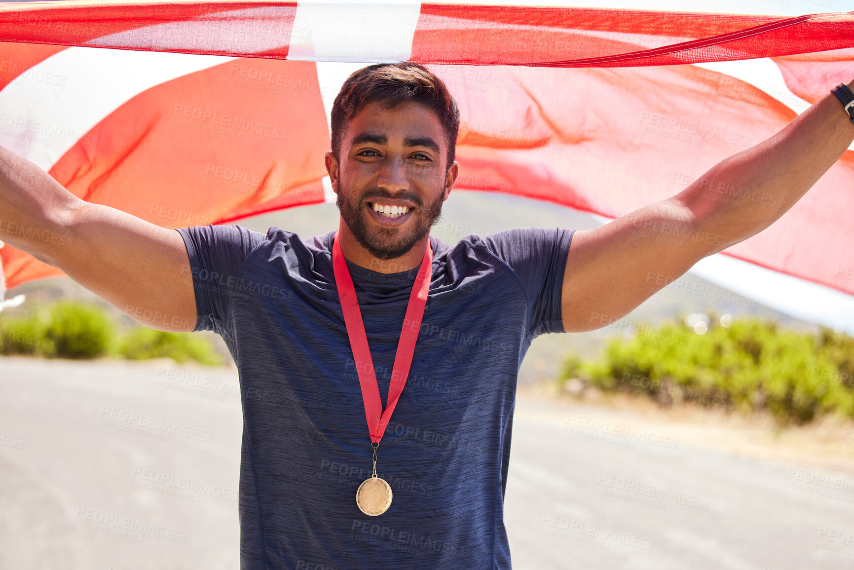 Buy stock photo Portrait, flag and man with a medal for winner, sports competition or winner in the street. Happy, Denmark and a professional athlete with representation of a country in running or national triathlon