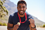 Runner, winner and portrait of happy man with medal on road for fitness goal, winning or running race. Sports champion, success or face of excited athlete with competition victory in cross country 