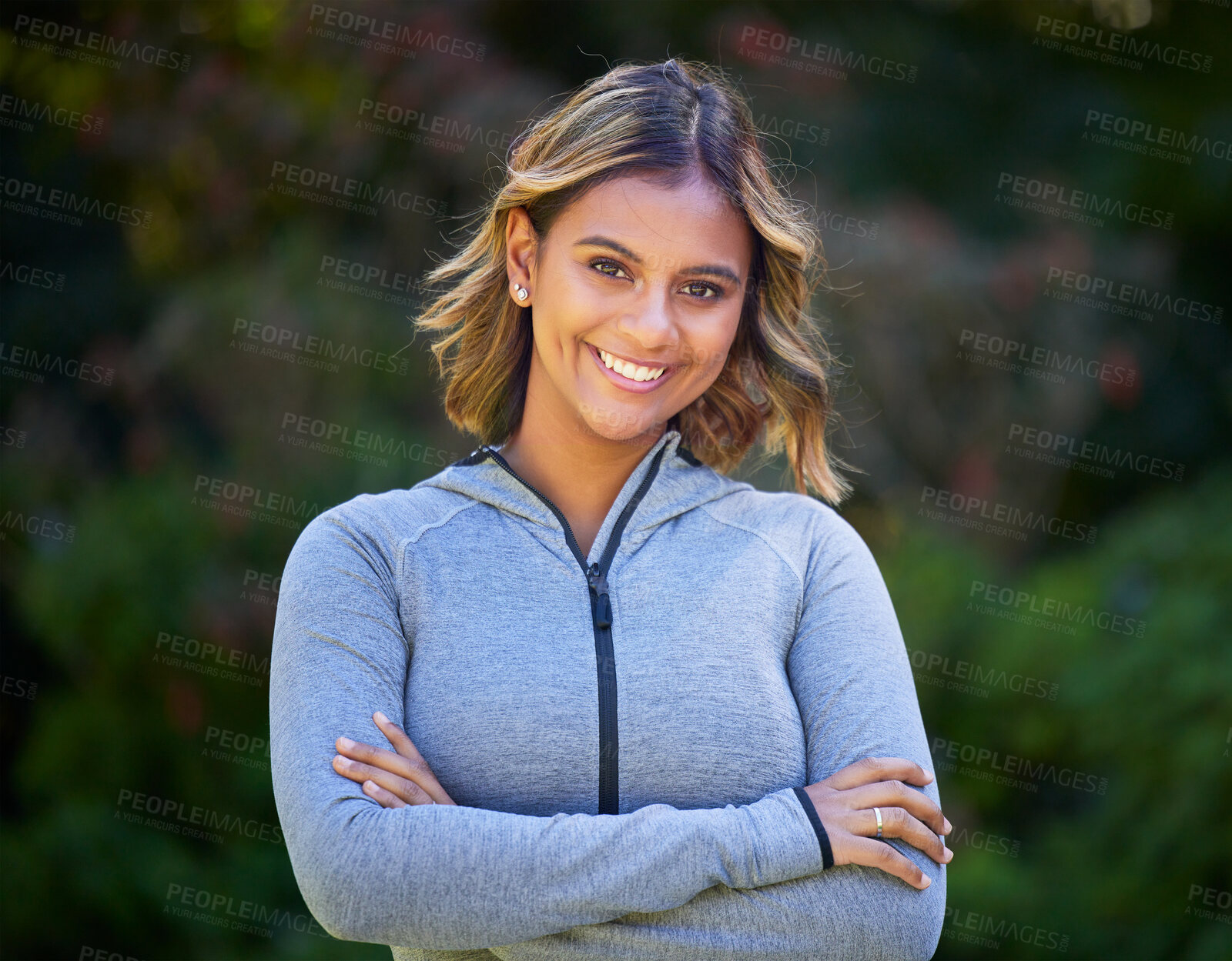 Buy stock photo Runner woman, arms crossed and portrait in park, smile and exercise with fitness training in nature. Indian girl, happy and pride for wellness, health or outdoor workout for body, self care or goals