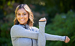 Nature, sports and portrait of a woman stretching her arms for an outdoor workout or training. Fitness, happy and young female athlete doing a warm up exercise in a park for cardio running in garden.