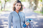 Runner woman, bottle and portrait in park, ready and exercise with fitness training in nature. Indian girl, commitment and pride for wellness, health or outdoor workout for body, self care or goals