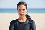 Fitness, beach and portrait of serious woman by the ocean ready for surf, exercise and workout. Female person, focus and face of a athlete from Hawaii outdoor by the sea in nature with training