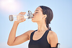 Woman, fitness and drinking water for natural nutrition or sustainability after workout, running or outdoor exercise. Thirsty female person with bottle of mineral for healthy wellness, break or rest