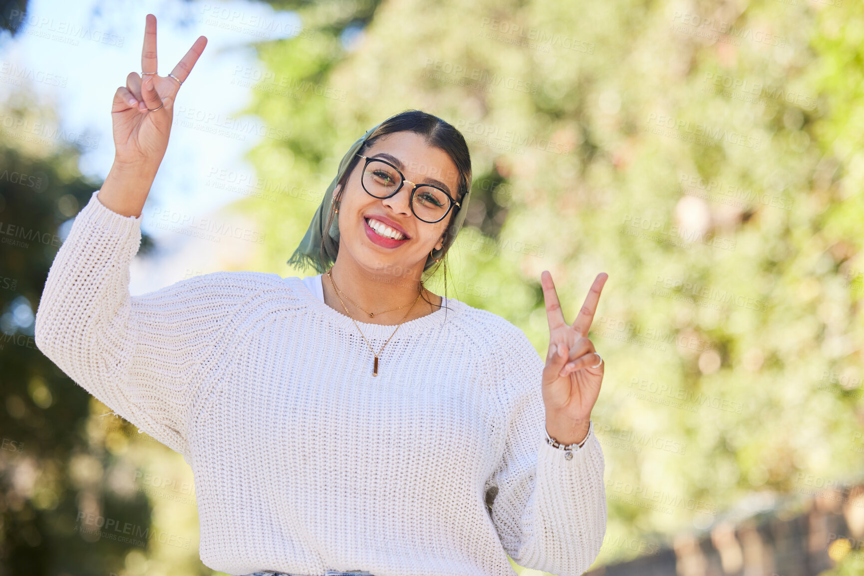 Buy stock photo Peace sign, woman portrait and outdoor with a smile of student on summer holiday and vacation. Motivation, happy and emoji v hand gesture feeling silly with freedom and female person from Sudan