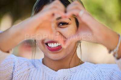 Buy stock photo Heart hands, love and smile with portrait of woman in park for support, health and kindness symbol. Peace, emoji and motivation with person and gesture in nature for empathy, trust and valentines day